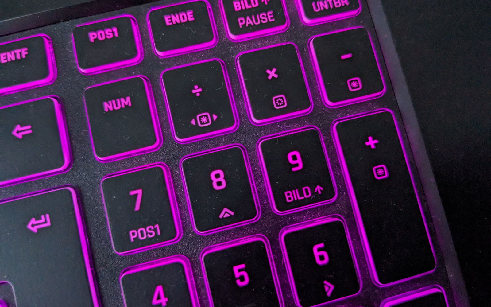 You can reach the extra functions printed on the keyboard of your TUXEDO laptop by additionally holding down the <kbd>FN</kbd> key.